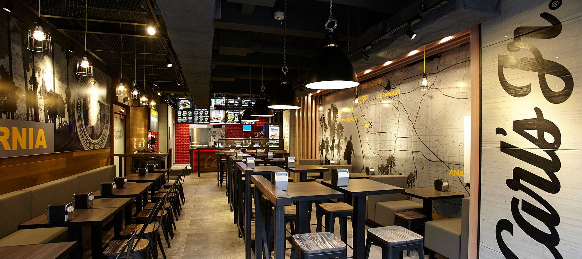 Carl's Jr. worker assembling burger